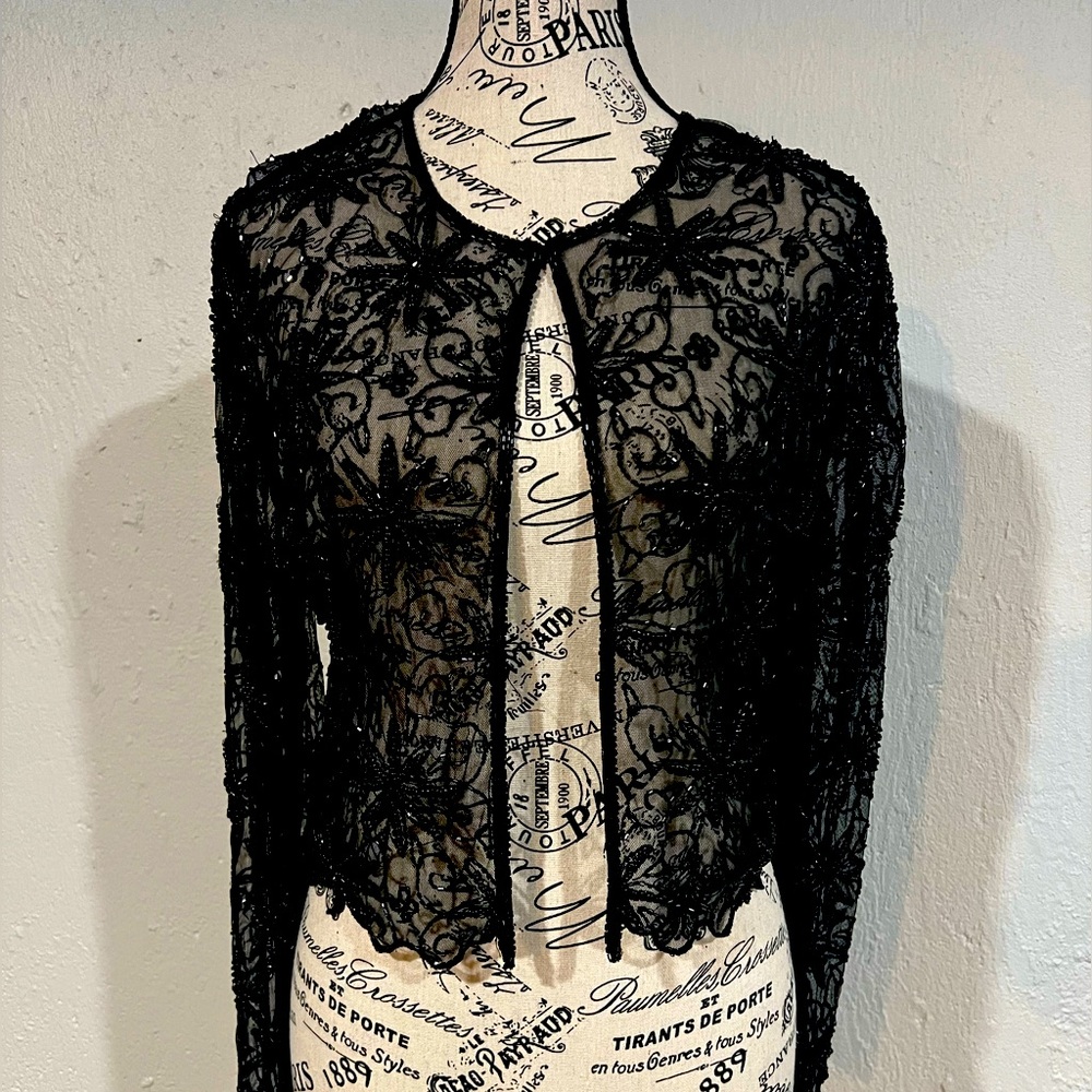 Shimmery beaded and sheer jacket adds glamour to your look